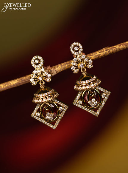 Earrings with ruby and cz stones in victorian finish