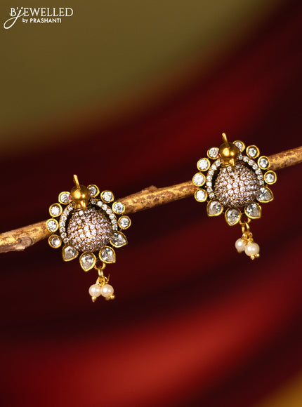 Earrings peacock design with cz stones and pearl hangings in victorian finish