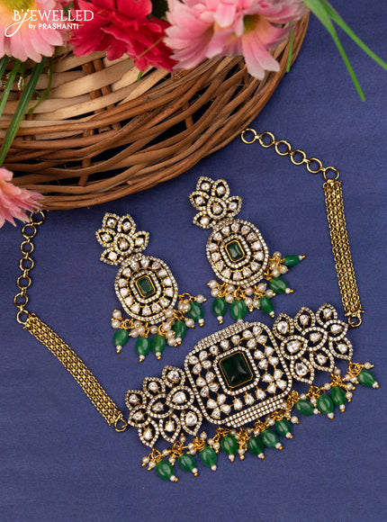 Choker with emerald & kundan stones and beads hanging in victorian finish