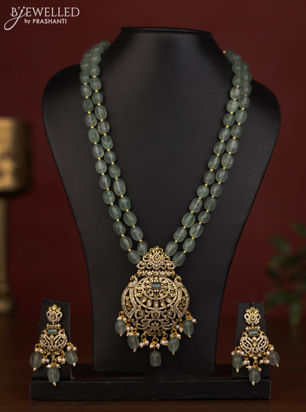 Beaded double layer mint green necklace peacock pendant with ruby & cz stones and beads hanging in victorian finish