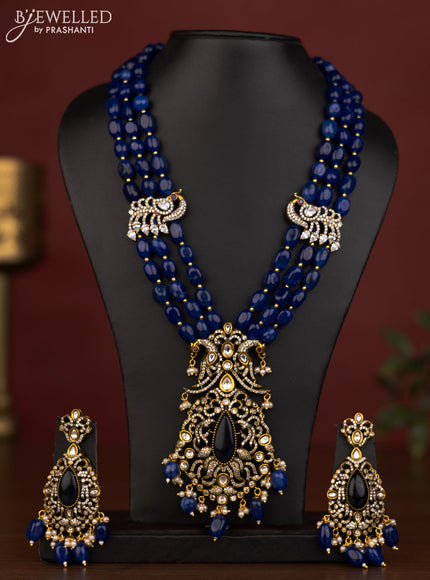 Beaded triple layer blue necklace peacock pendant with ruby & cz stones and beads hanging in victorian finish