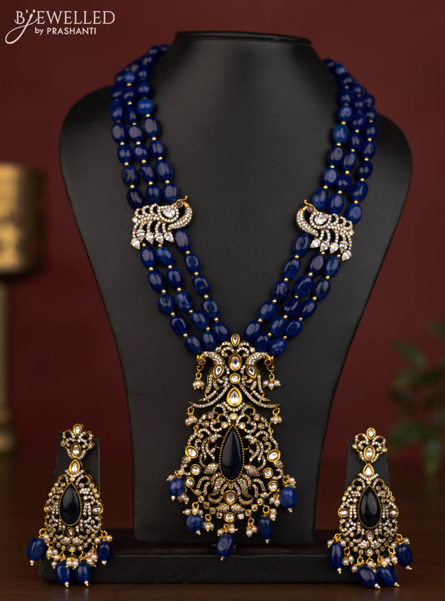 Beaded triple layer blue necklace peacock pendant with ruby & cz stones and beads hanging in victorian finish