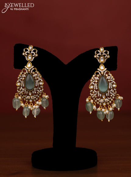 Beaded triple layer mint green necklace peacock pendant with ruby & cz stones and beads hanging in victorian finish