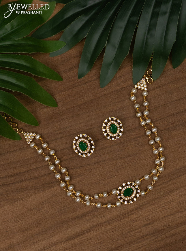 Pearl choker with emerald and cz stones