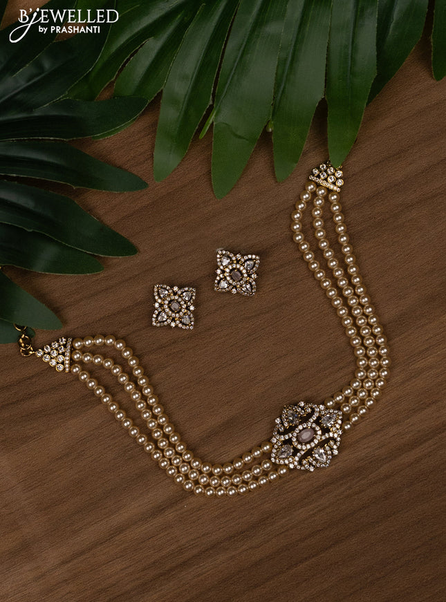 Pearl choker with baby pink and cz stones