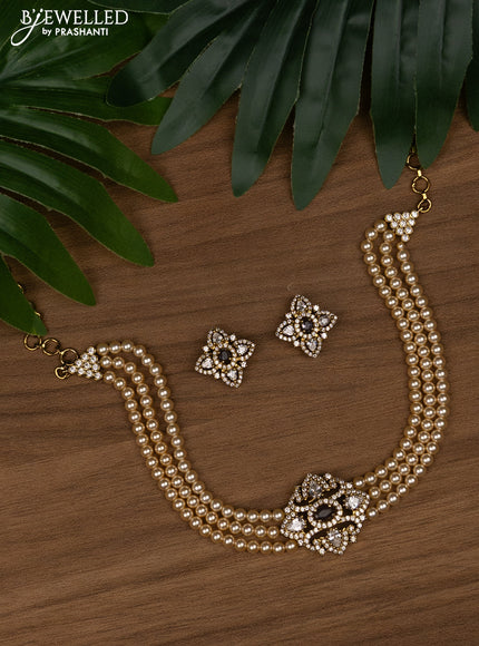 Pearl choker with violet and cz stones