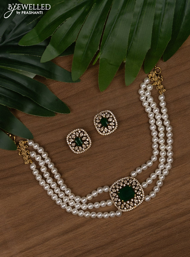 Pearl choker with emerald and cz stones