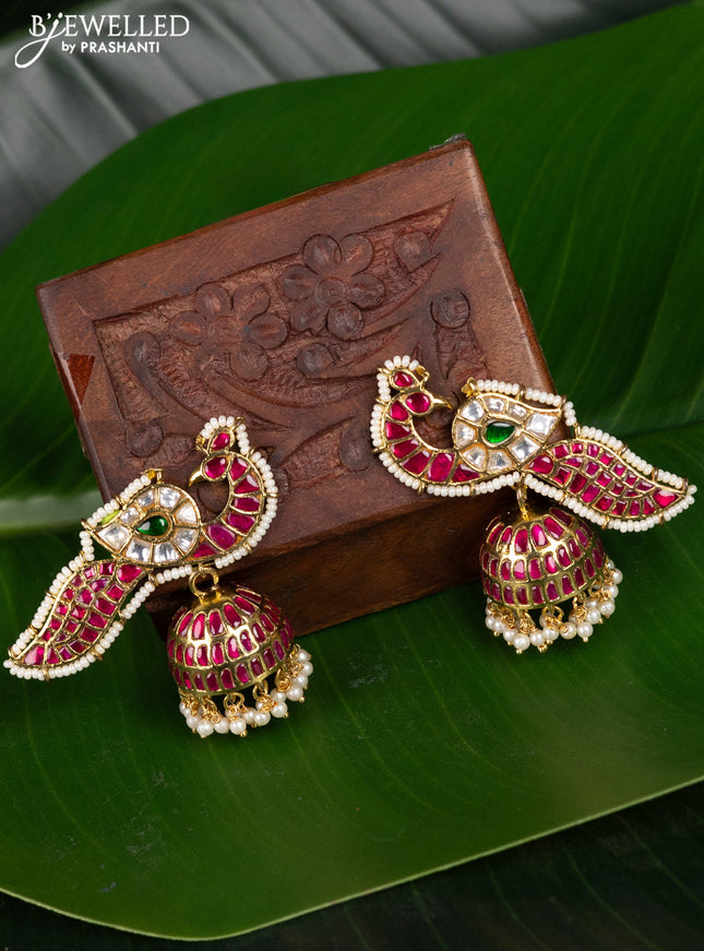 Antique jhumka peacock design with jadau kundan stones and pearl hangings