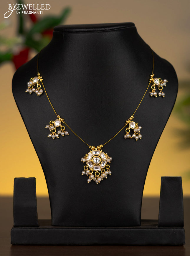 Invisible chain floral pendant with kundan stones and pearl hangings without earrings