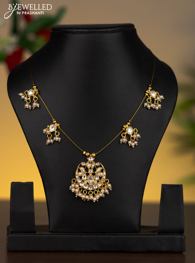 Invisible chain chandbali pendant with kundan stones and pearl hangings without earrings