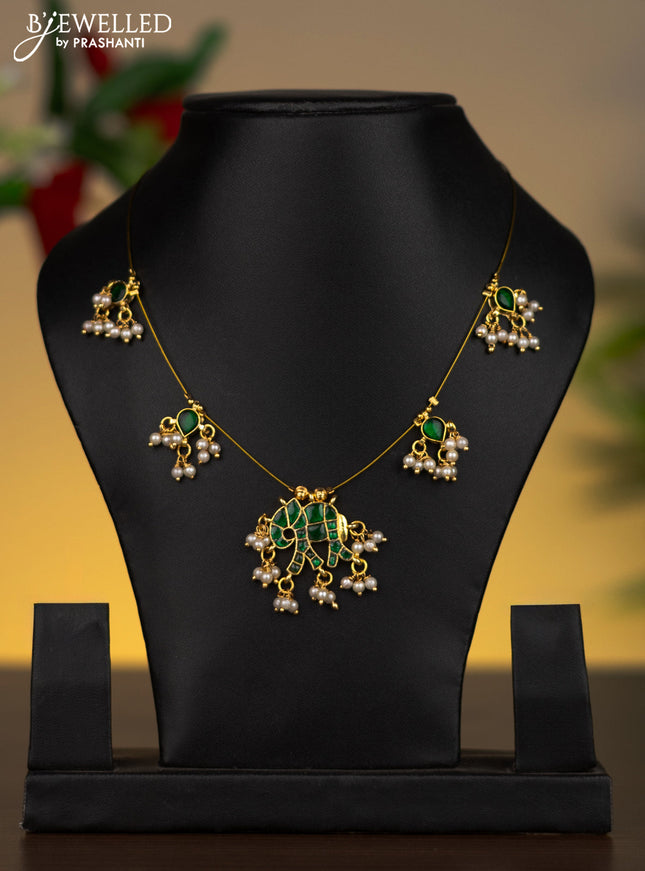 Invisible chain elephant pendant with emerald stones and pearl hangings without earrings