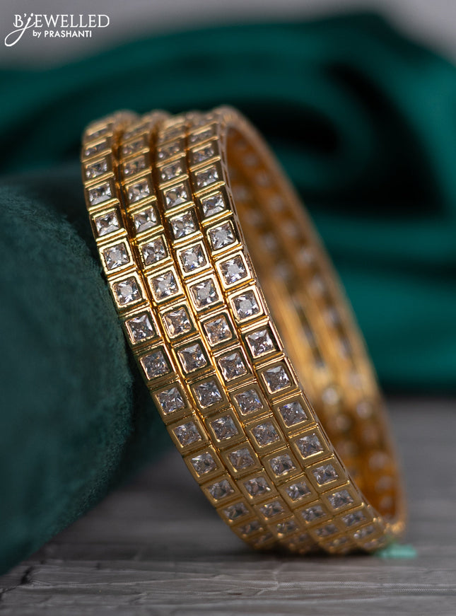 Zircon bangle with cz stones in gold finish