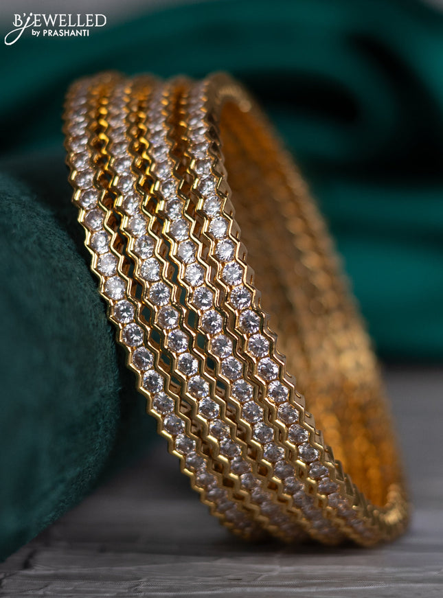 Zircon bangle with cz stones in gold finish