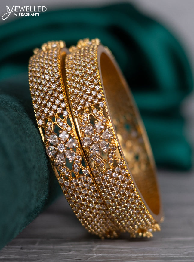 Zircon bangle floral design with cz stones in gold finish