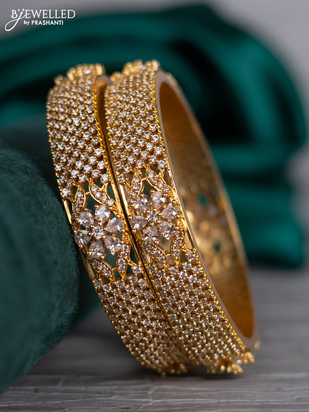Zircon bangle floral design with cz stones in gold finish