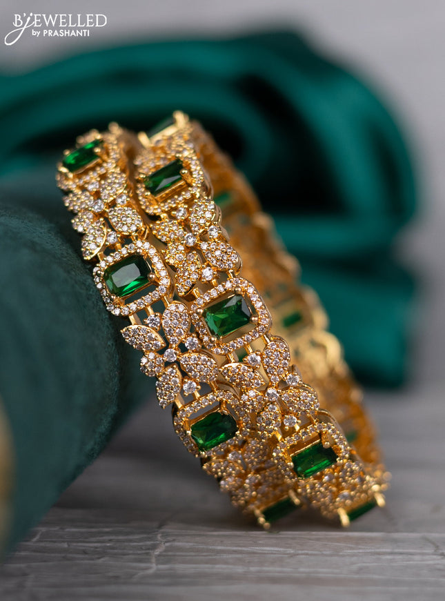 Zircon bangle with emerald and cz stones in gold finish
