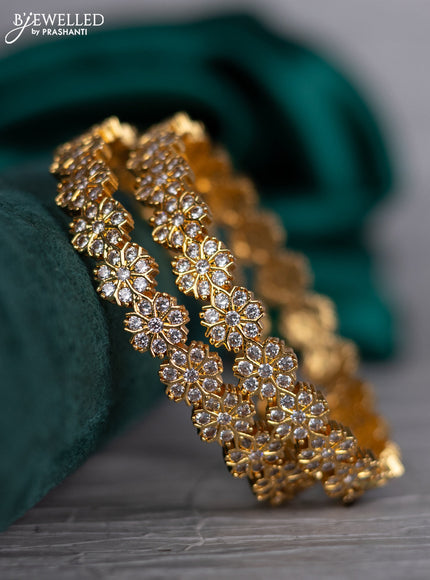 Zircon bangle floral design with cz stones in gold finish