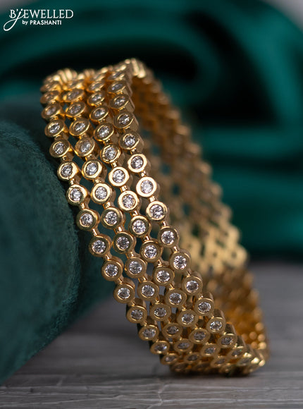 Zircon bangle with cz stones in gold finish