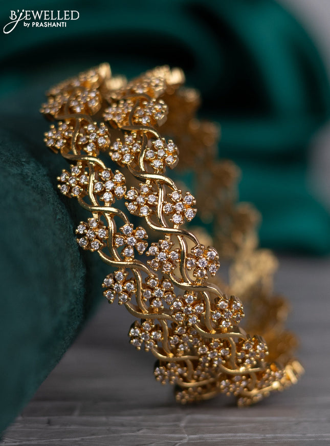 Zircon bangle floral design with cz stones in gold finish
