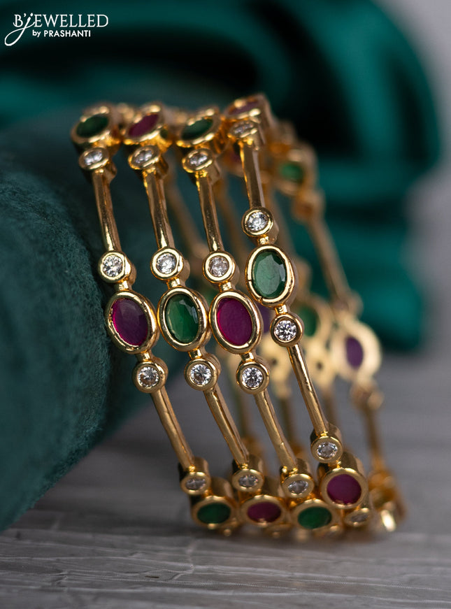 Zircon bangle with kemp and cz stones in gold finish
