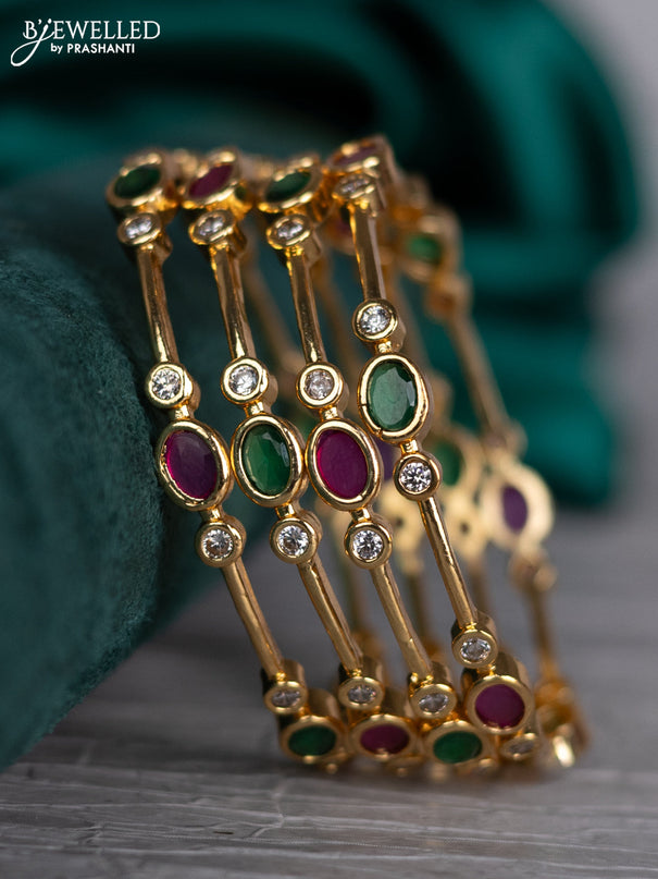 Zircon bangle with kemp and cz stones in gold finish