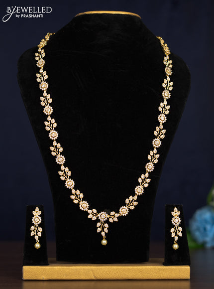 Zircon haaram leaf design with cz stones and pearl hanging in gold finish