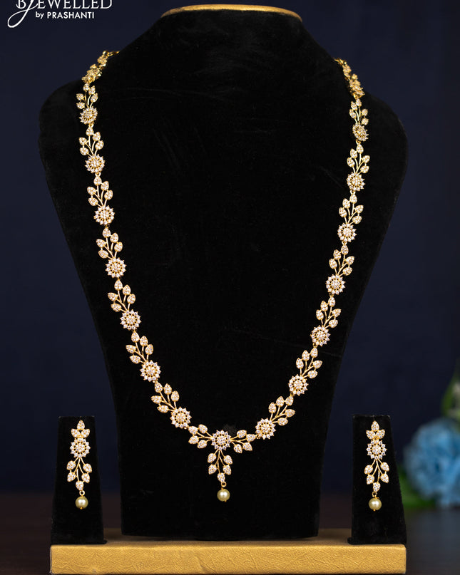 Zircon haaram leaf design with cz stones and pearl hanging in gold finish