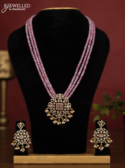 Beaded triple layer baby pink necklace with cz stones and pearl & beads hanging in victorian finish
