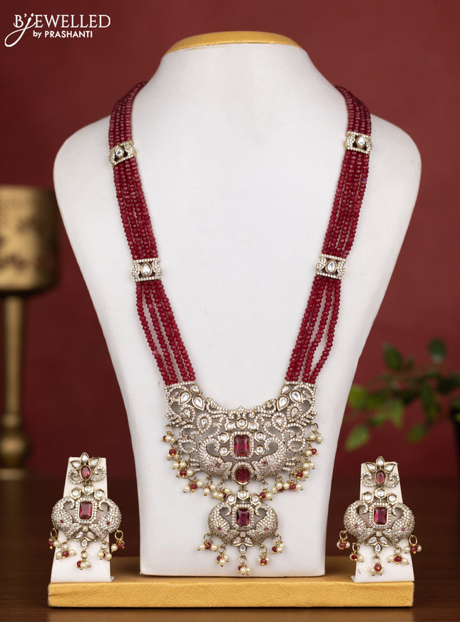 Beaded multilayer maroon necklace with ruby kundan & cz stones and pearl & beads hanging in victorian finish