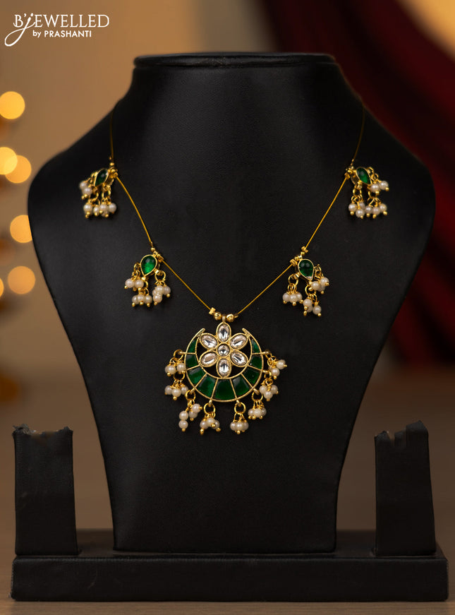 Invisible chain chandbali pendant with green jadau kundan stones and pearl hangings without earring