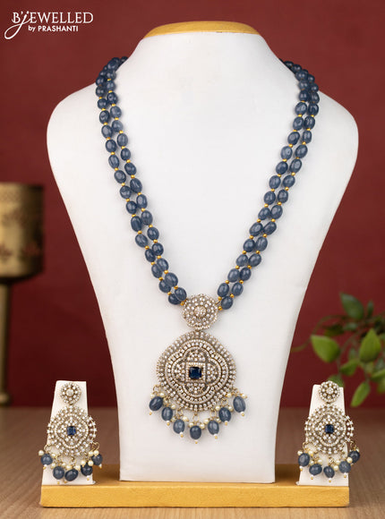 Beaded blue necklace with sapphire & cz stones and pearl & beads hanging in victorian finish