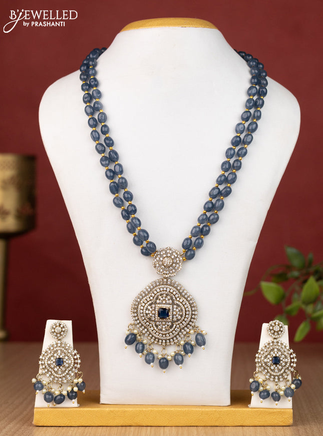 Beaded blue necklace with sapphire & cz stones and pearl & beads hanging in victorian finish