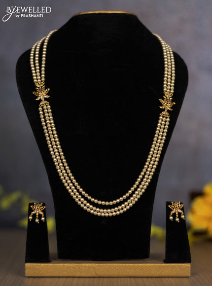 Pearl triple layer haram with lotus side pendant and kemp & cz stones