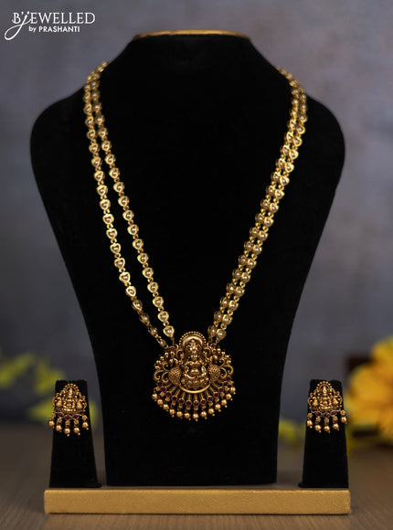 Pearl double layer haram lakshmi pendant with ruby stones and golden beads hanging