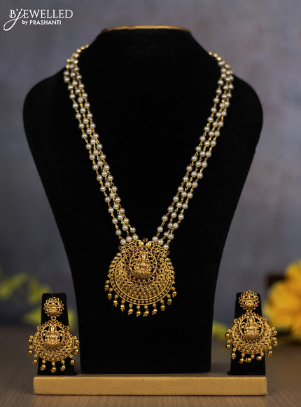 Pearl triple layer haram lakshmi pendant with ruby stones and golden beads hanging