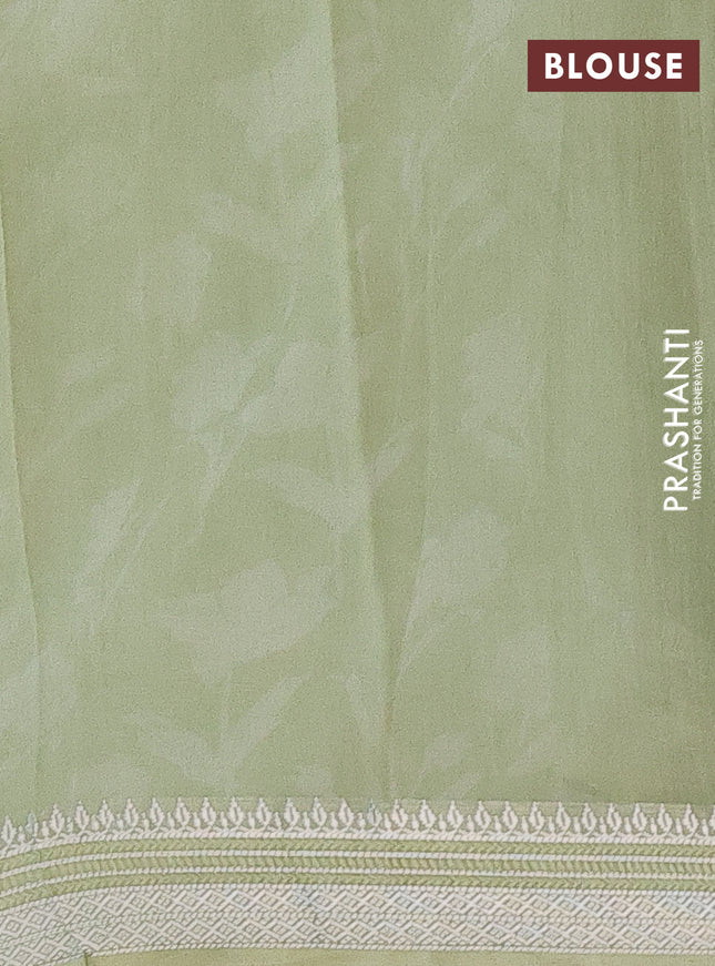 Chanderi silk cotton saree pastel green with allover floral prints and silver zari woven border