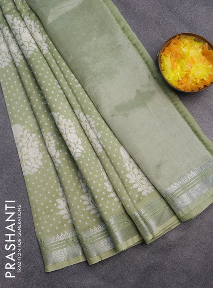 Chanderi silk cotton saree pista green shade with allover floral prints and silver zari woven border