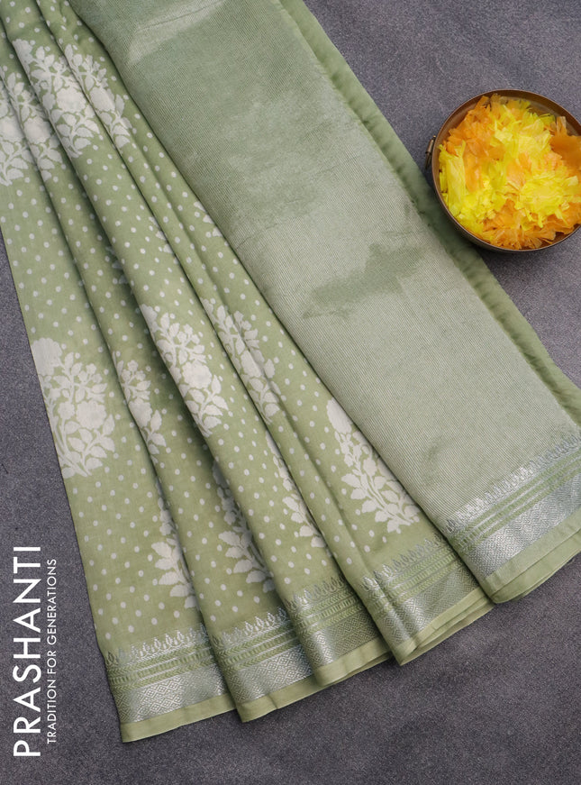 Chanderi silk cotton saree pista green shade with allover floral prints and silver zari woven border