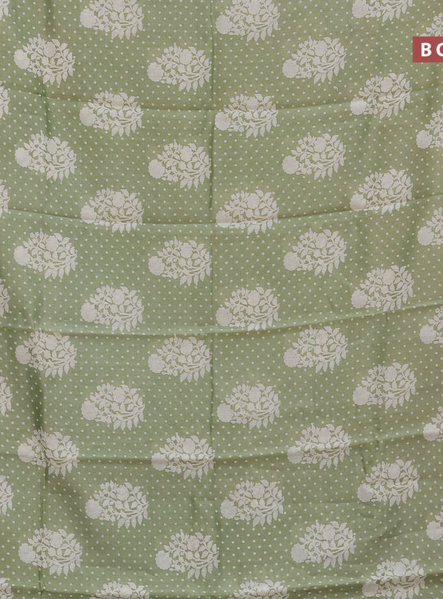 Chanderi silk cotton saree pista green shade with allover floral prints and silver zari woven border