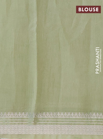Chanderi silk cotton saree pista green shade with allover floral prints and silver zari woven border