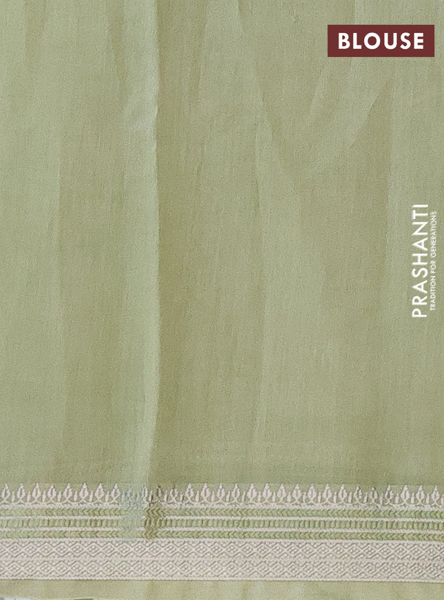 Chanderi silk cotton saree pista green shade with allover floral prints and silver zari woven border