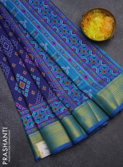 Semi tussar saree blue and cs blue with allover ikat prints and zari woven border