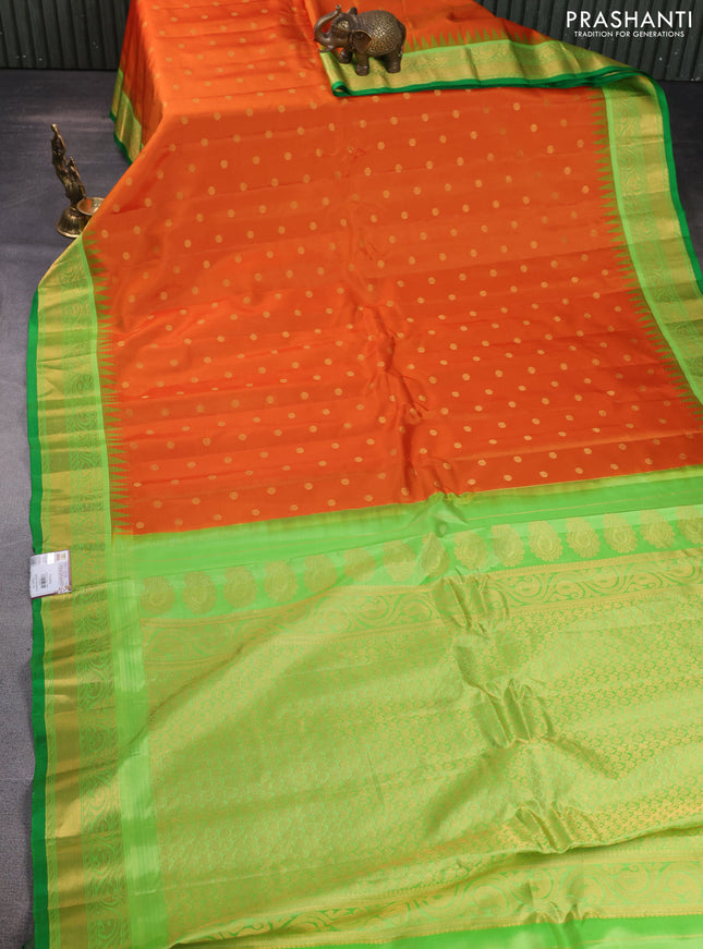 Pure gadwal silk saree sunset orange and light green with zari woven buttas and temple design zari woven border