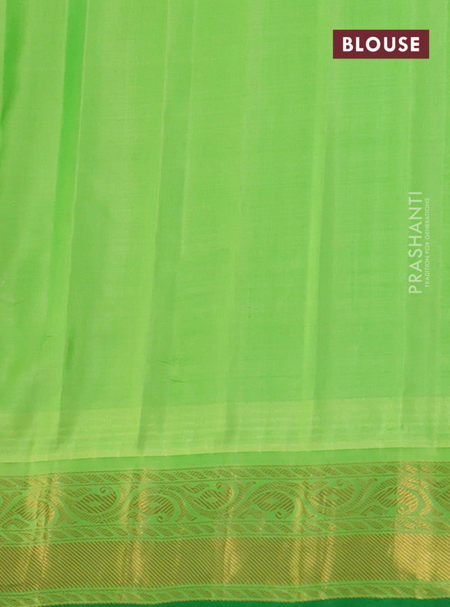 Pure gadwal silk saree sunset orange and light green with zari woven buttas and temple design zari woven border