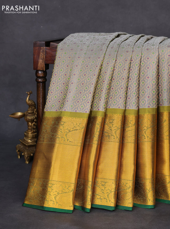 Pure gadwal silk saree grey and mehendi green with allover zari woven brocade weaves and long rich zari woven border