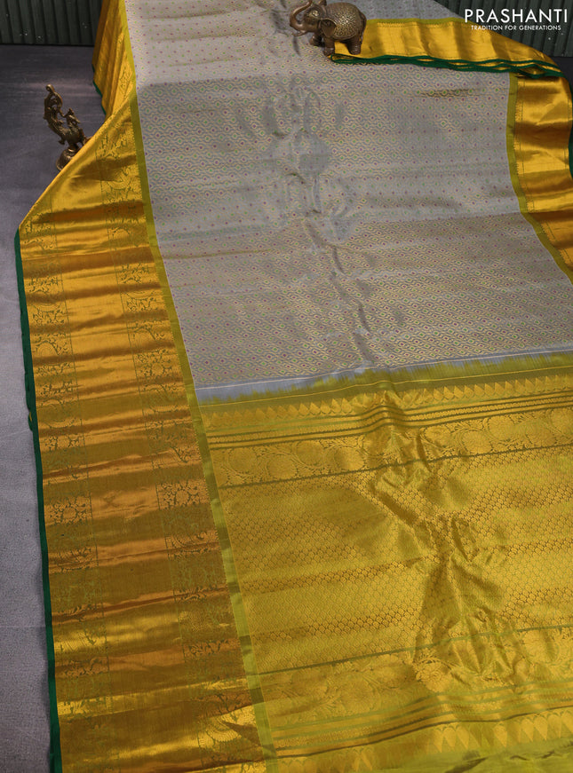 Pure gadwal silk saree grey and mehendi green with allover zari woven brocade weaves and long rich zari woven border