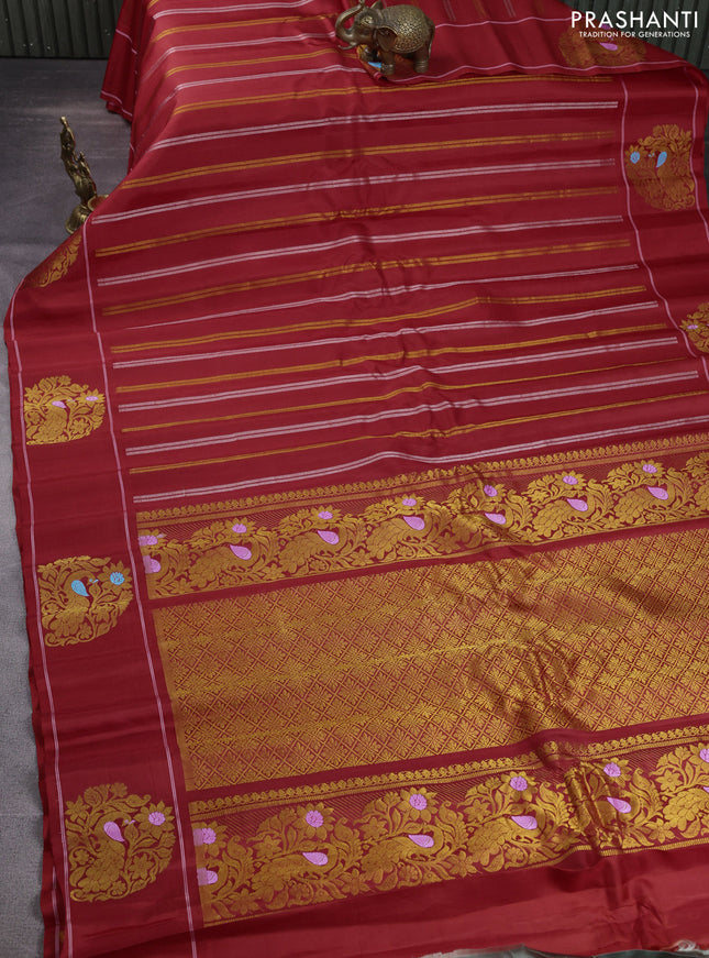 Pure gadwal silk saree red with allover silver & gold zari weaves and peacock design zari woven butta border