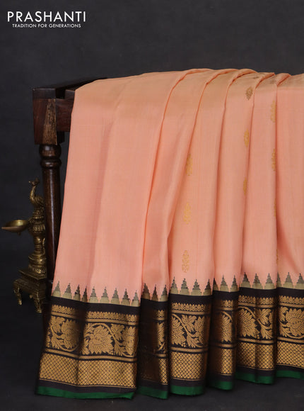 Pure gadwal silk saree peach orange and black with zari woven buttas and temple design zari woven border