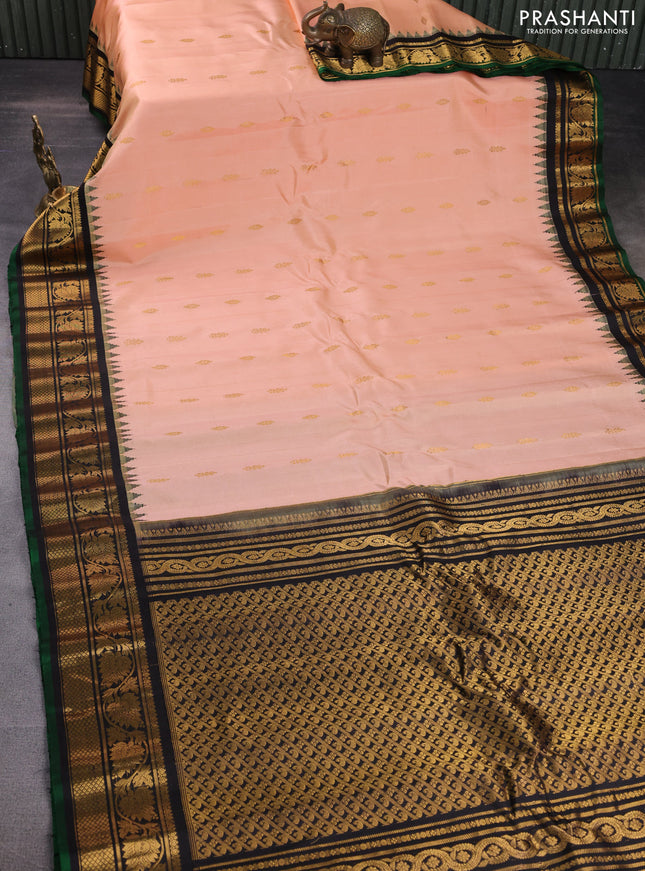 Pure gadwal silk saree peach orange and black with zari woven buttas and temple design zari woven border