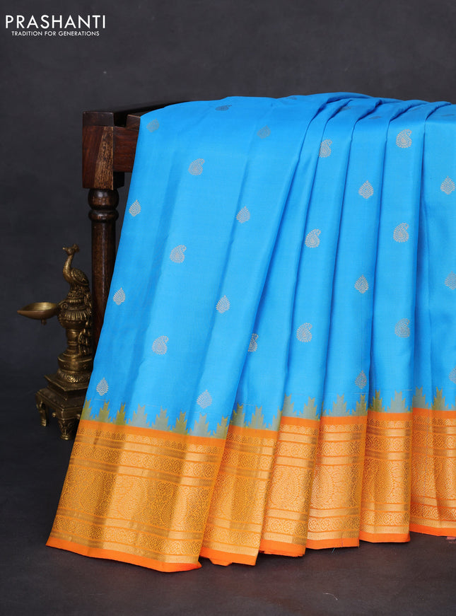 Pure gadwal silk saree light blue and orange with zari woven buttas and temple design zari woven border